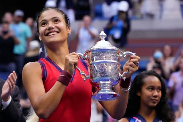 Emma Raducanu celebrates with the US Open trophy following her victory over Leylah Fernandez at Flushing Meadows. (Photo by TIMOTHY A. CLARY/AFP via Getty Images)