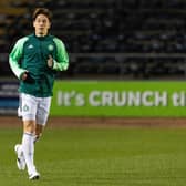 Celtic defender Yuki Kobayashi warms up ahead of taking part in Cammy Kerr's Dundee testimonial match at Dens Park. (Photo by Ross Parker / SNS Group)