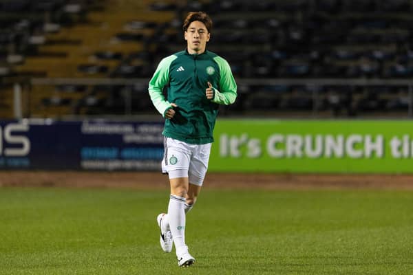 Celtic defender Yuki Kobayashi warms up ahead of taking part in Cammy Kerr's Dundee testimonial match at Dens Park. (Photo by Ross Parker / SNS Group)