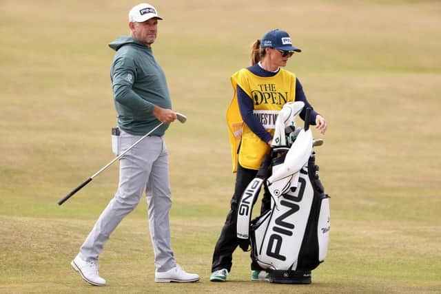 Lee Westwood looks on alongside caddie and wife Helen during the first round of the 150th Open at St Andrews. Picture: Warren Little/Getty Images.