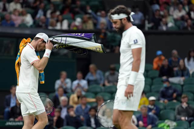 Close contact ... Murray streaked into a lead against Nikoloz Basilashvili but was then pegged back