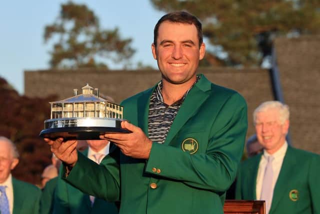 Scottie Scheffler poses with trophy wearing his Green Jacket after winning the 86th Masters at Augusta National Golf Club. Picture: David Cannon/Getty Images.