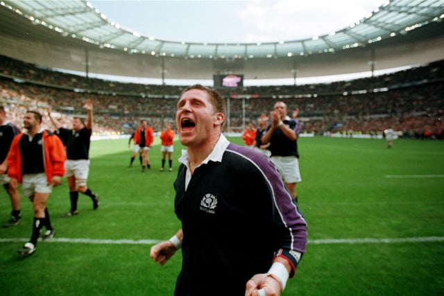 Alan Tait roars in victory after Scotland's famous 36-22 win at the Stade de France in 1999. Tait's two tries, two more from Martin Leslie and one from Gregor Townsend secured the triumph for the Scots, with all five tries coming in a blistering first half. Scotland had already beaten Wales and Ireland and lost narrowly to England. Jim Telfer's side were crowned Five Nations champions the following day when England lost to Wales.