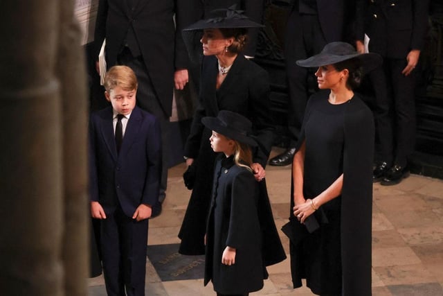 Princess of Wales, Princess Charlotte of Wales, Prince George of Wales and Meghan, Duchess of Sussex attend Westminster Abbey for the State Funeral of Queen Elizabeth II.