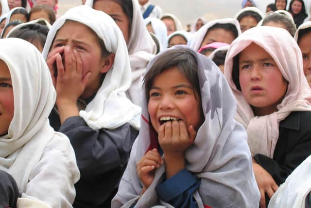 Girls attend a circus performance in Kabul, with the treat funded by the Linda Norgrove Foundation. PIC:LNF.