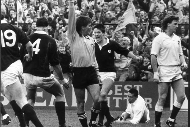 Referee David Bishop signals the try scored by an ecstatic Tony Stanger against England.