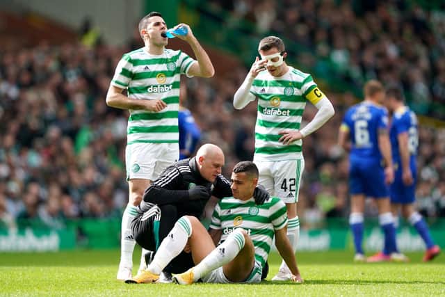 Celtic's Giorgios Giakoumakis receives medical attention prior to being substituted in the first half against St Johnstone. (Photo credit: Andrew Milligan/PA Wire)
