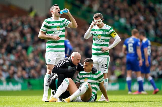Celtic's Giorgios Giakoumakis receives medical attention prior to being substituted in the first half against St Johnstone. (Photo credit: Andrew Milligan/PA Wire)