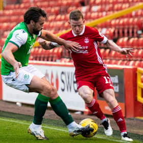 Aberdeen's Jonny Hayes (right) is unable to get past Darren McGregor  as Hibs produce a dogged display to wrap up third place at Pittodrie midweek. Photo by Mark Scates / SNS Group
