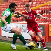 Aberdeen's Jonny Hayes (right) is unable to get past Darren McGregor  as Hibs produce a dogged display to wrap up third place at Pittodrie midweek. Photo by Mark Scates / SNS Group