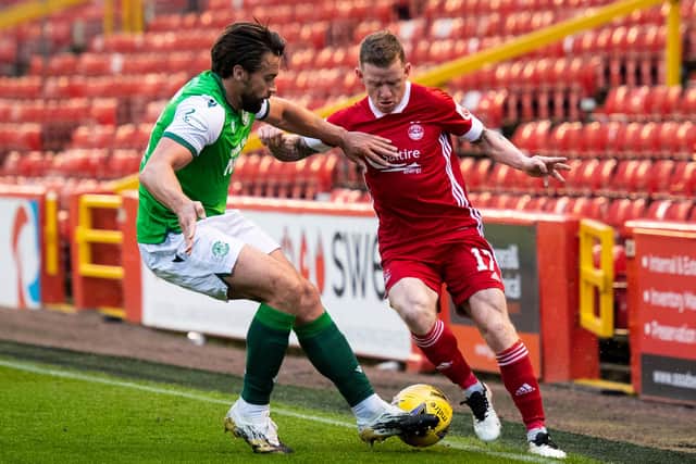 Aberdeen's Jonny Hayes (right) is unable to get past Darren McGregor  as Hibs produce a dogged display to wrap up third place at Pittodrie midweek. Photo by Mark Scates / SNS Group