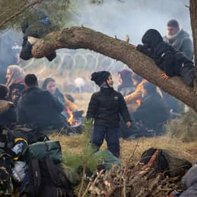 Migrants camped near the Belarusian-Polish border in the Grodno region (Picture: Leonid Shcheglov/Belta/AFP via Getty Images)