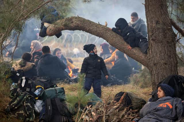 Migrants camped near the Belarusian-Polish border in the Grodno region (Picture: Leonid Shcheglov/Belta/AFP via Getty Images)