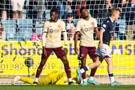 Hearts' Gerald Taylor (centre) scores an own goal to make it 2-0 to Dundee.  (Photo by Craig Foy / SNS Group)
