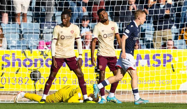 Hearts' Gerald Taylor (centre) scores an own goal to make it 2-0 to Dundee. (Photo by Craig Foy / SNS Group)