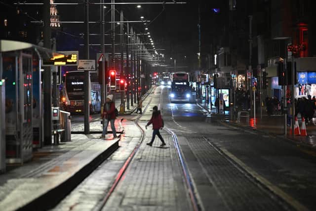 People on the near deserted Princes Street after all outdoor events including the street party and fireworks display planned for Hogmanay were cancelled.(Picture: Andy Buchanan/PA Wire)
