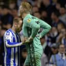 Sheffield Wednesday captain Barry Bannan encourages goalkeeper Cameron Dawson during the penalty shoot-out.