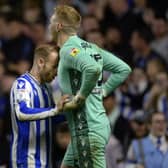 Sheffield Wednesday captain Barry Bannan encourages goalkeeper Cameron Dawson during the penalty shoot-out.