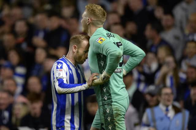 Sheffield Wednesday captain Barry Bannan encourages goalkeeper Cameron Dawson during the penalty shoot-out.