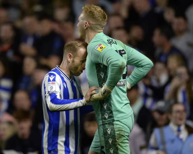 Sheffield Wednesday captain Barry Bannan encourages goalkeeper Cameron Dawson during the penalty shoot-out.