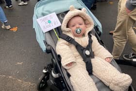 7-month-old Remy from the East End of Glasgow held up a small placard in his pram, stating ‘there is no planet B’ as he wore a teddy-bear onesie.