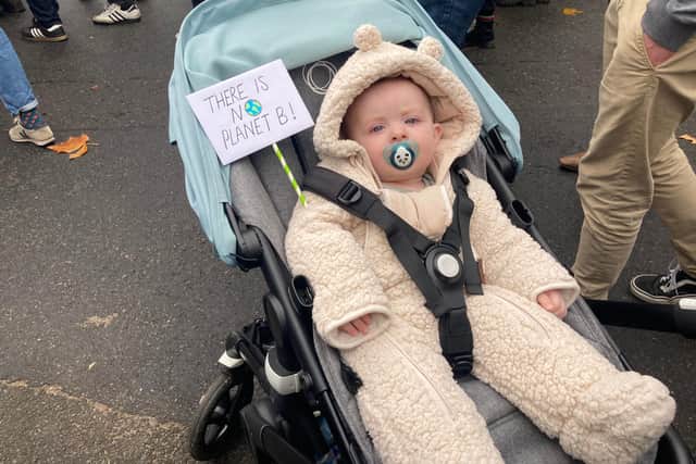 7-month-old Remy from the East End of Glasgow held up a small placard in his pram, stating ‘there is no planet B’ as he wore a teddy-bear onesie.
