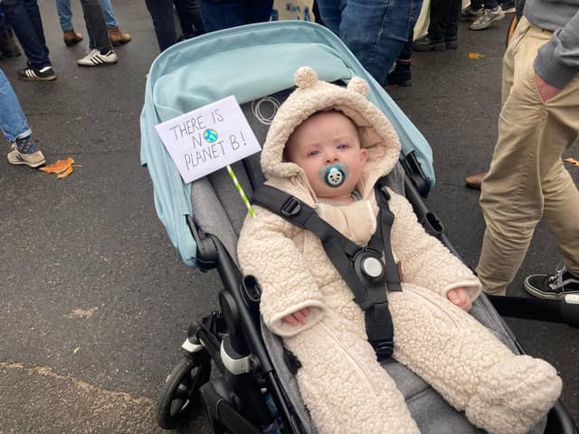 7-month-old Remy from the East End of Glasgow held up a small placard in his pram, stating ‘there is no planet B’ as he wore a teddy-bear onesie.