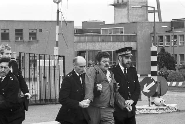 Members of the NUM miners' union picket line clash with police outside Bilston Glen colliery during the miners strike in June 1984.