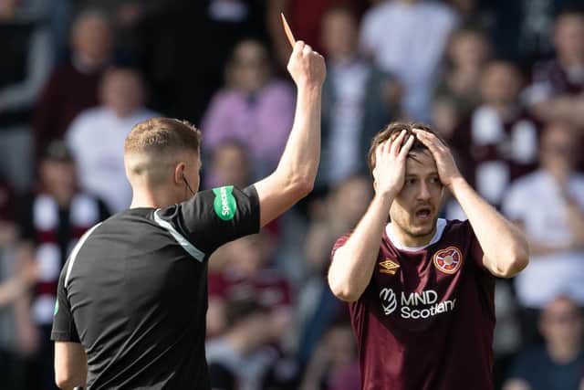 Hearts midfielder Peter Haring looks shocked as he is sent off by referee David Dickinson during the 2-2 draw at St Mirren. (Photo by Alan Harvey / SNS Group)