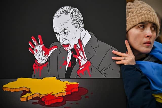 A Ukrainian woman protests in London on February 24, 2022, the day Vladimir Putin launched the full-scale Russian invasion (Picture: Jeff J Mitchell/Getty Images)