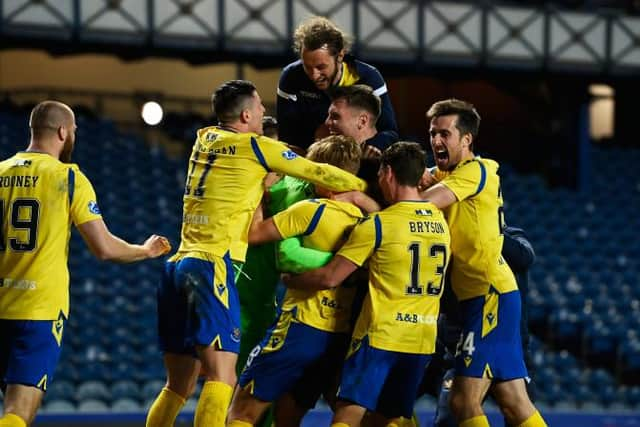 St Johnstone's players celebrate after their penalty shoot-out victory over Rangers at Ibrox in the Scottish Cup. (Photo by Rob Casey / SNS Group)