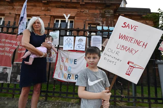 Maureen Cannell with grandchildren, Mallory and Mathew Gallacher outside Whiteinch Library, Glasgow. Picture: John Devlin