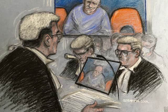 Court artist sketch by Elizabeth Cook of Lord Justice Fulford (left) with Pc Wayne Couzens attending a murder plea hearing at the Old Bailey, by video link from Belmarsh top security jail in south London.