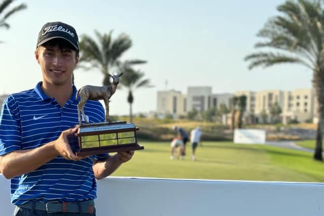 Gullane's Sam Mukherjee shows off the Abu Dhabi Amateur Championship trophy after his eye-catching win at Saadiyat Beach.