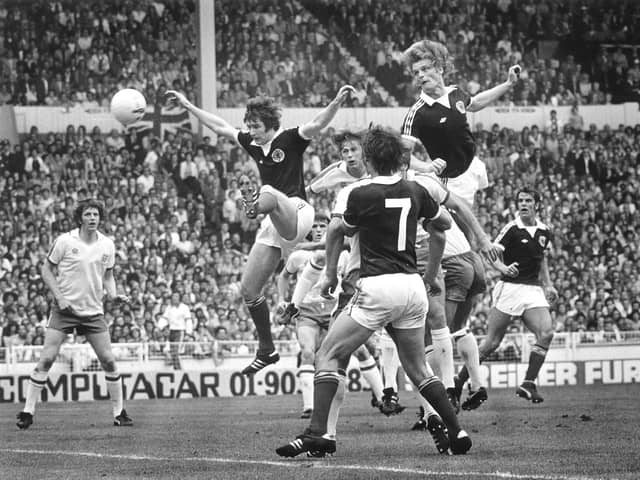 Gordon McQueen powers home a header to set Scotland up for a famous 2-1 victory over England at Wembley in 1977. Pic: Denis Straughan.