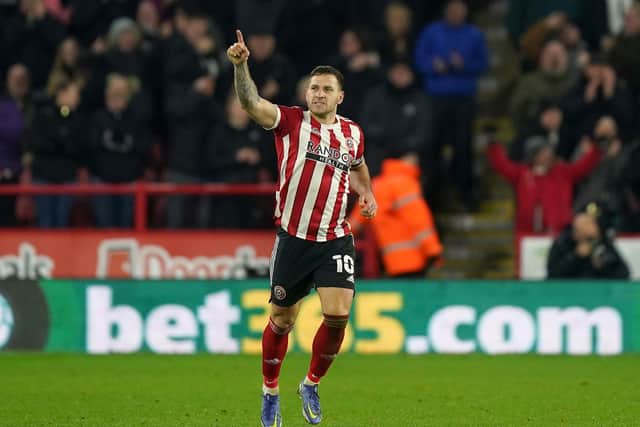 A man has been arrested on suspicion of assault after Sheffield United captain Billy Sharp was apparently attacked when Nottingham Forest fans spilled on to the pitch at the end of the Sky Bet Championship play-off semi-final.