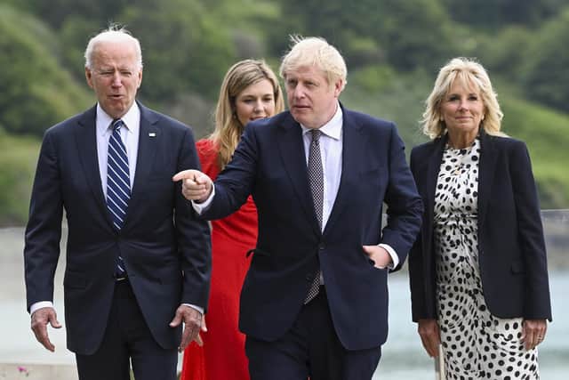 (From left) US President Joe Biden, Carrie Johnson, Britain's Prime Minister Boris Johnson and First Lady Jill Biden walk outside Carbis Bay Hotel in Cornwall. Picture: Toby Melville/Pool Photo via AP
