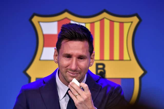 Lionel Messi cries during his press conference at the Camp Nou stadium in Barcelona.