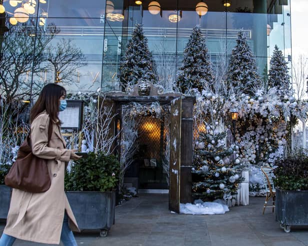 Shopper walks past Ivy in the Square, Edinburgh