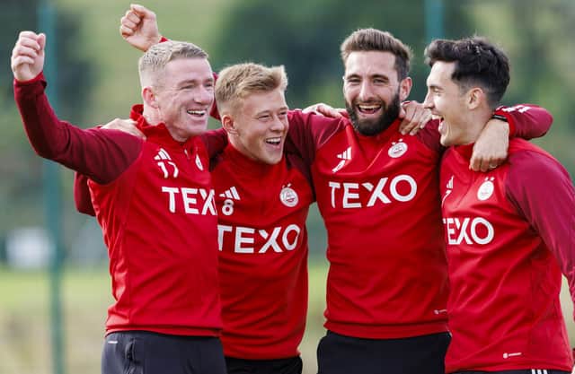 Aberdeen teammates (from left) Jonny Hayes, Connor Barron, Graeme Shinne and Jamie McGrath share a laugh during training on Wednesday ahead of the Europa League play-off 2nd leg against BK Hacken at Pittodrie. (Photo by Mark Scates / SNS Group)