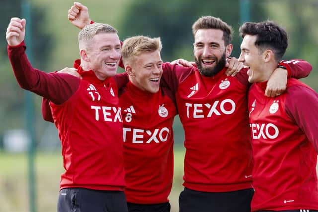 Aberdeen teammates (from left) Jonny Hayes, Connor Barron, Graeme Shinne and Jamie McGrath share a laugh during training on Wednesday ahead of the Europa League play-off 2nd leg against BK Hacken at Pittodrie. (Photo by Mark Scates / SNS Group)