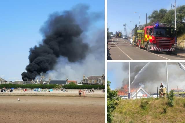 Photos from the scene show flames on the roof of the building with thick black smoke billowing into the sky. (Credit: @plaintosee, Donna Read and @StephanieCC11)