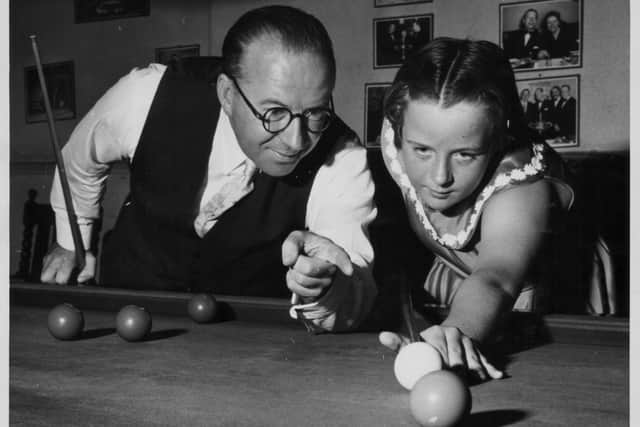 Eight-time snooker world champion Fred Davis, pictured practising with his daughter Lynne, remained on the professional tour until 1993, aged 80. Picture: Fox Photos/Hulton Archive/Getty Images