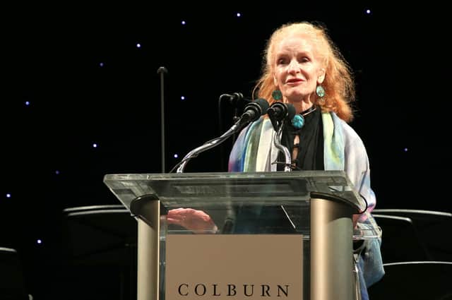 Carol Colburn Grigor speaks onstage in Los Angeles