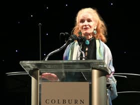 Carol Colburn Grigor speaks onstage in Los Angeles