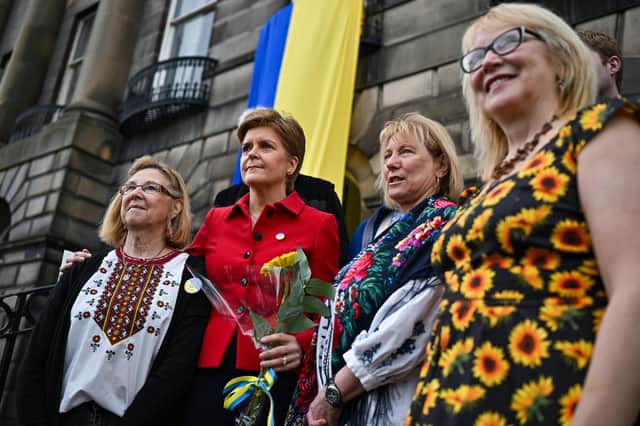Nicola Sturgeon  meets Linda Allison (left), Senia Urquhart, Hannah Beaton - Hawryluk (right) at the Edinburgh Ukrainian Club, to speak to members of the Ukrainian community about their concerns and view some of the donations that are being processed at the club.