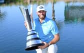 Dustin Johnson celebrates winning the Saudi International powered by SoftBank Investment Advisers for the second time at Royal Greens Golf and Country Club in King Abdullah Economic City in February. Picture: Ross Kinnaird/Getty Images.