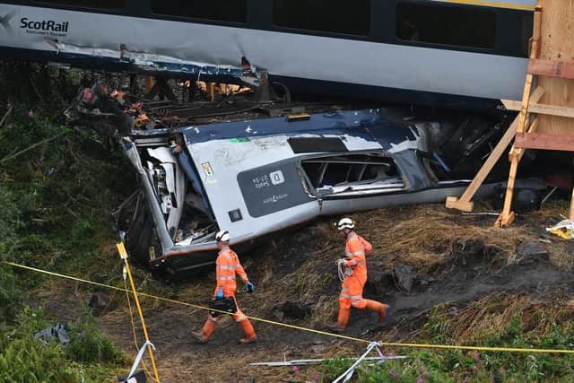 A mangled carriage crushed under another one. Picture: John Devlin.