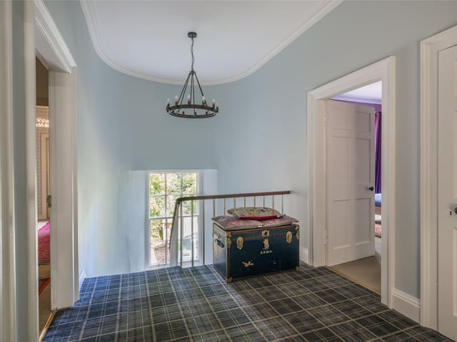 With a delightful symmetrical stone exterior under a slate roof, the extensive accommodation is laid out over two floors.