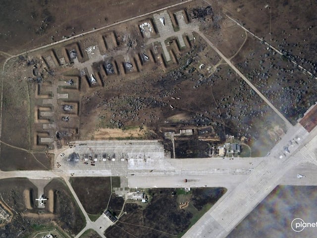 The destroyed Russian aircraft at Saky Air Base after an explosion Tuesday, Aug. 9, 2022, in the Crimean Peninsula. Ukraine's air force said Wednesday, Aug. 10, 2022 that nine Russian warplanes were destroyed in a deadly string of explosions at an air base in Crimea.